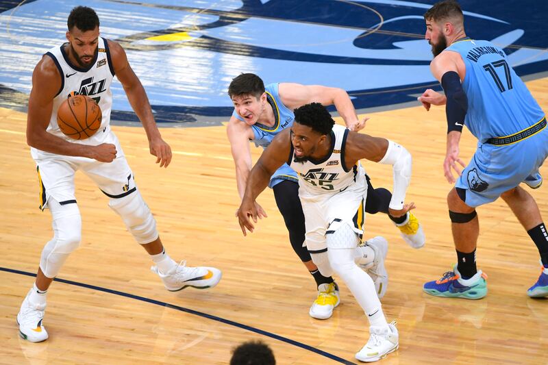 Utah Jazz guard Donovan Mitchell tries to fend off Memphis Grizzlies guard Grayson Allen on Saturday, May 29, 2021, in Memphis, Tenn.