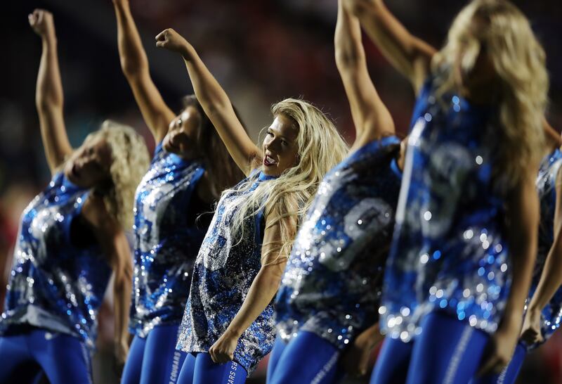 Members of the Cougarettes perform at LaVell Edwards Stadium.