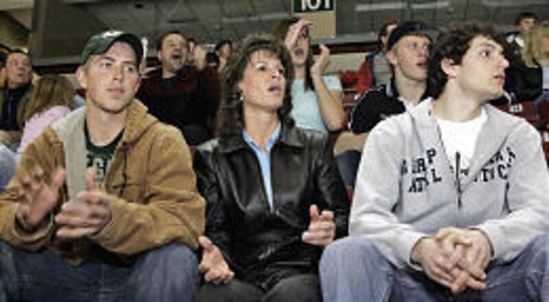 Colton McDonald, left, and his mom, Terry, are hosting hockey player Tony Moser, right. Colton also plays for the Northwest Regulators.