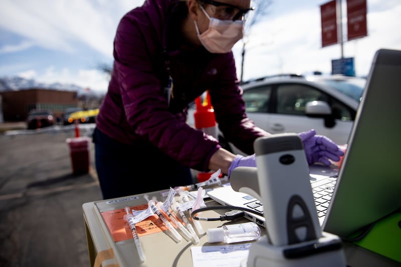 Syringes of the Johnson & Johnson COVID-19 vaccine wait to be used as registered nurse Mary Daily prepares to administer one to a patient at a drive-thru vaccination clinic at Intermountain Healthcare’s The Orthopedic Specialty Hospital in Murray on Thursday, March 4, 2021. The recent pause on the Johnson & Johnson COVID-19 vaccine could lift as soon as Friday.