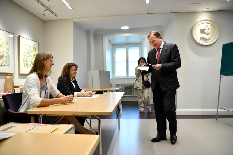 Swedish Prime Minister Stefan Lofven prepares to cast his vote at a polling station during the European Parliament elections in Stockholm, Sweden, Sunday, May 26, 2019. (Erik Simander/TT News Agency via AP)