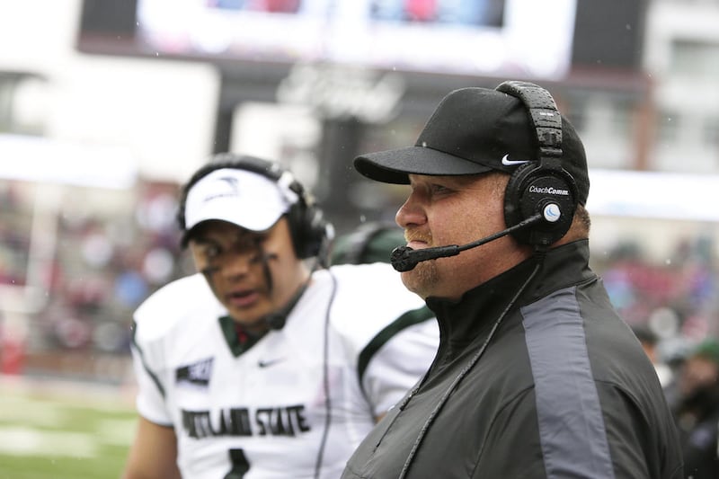 Portland State head coach Bruce Barnum, right, watches during the first half of a game against Washington State, in Pullman, Washington.