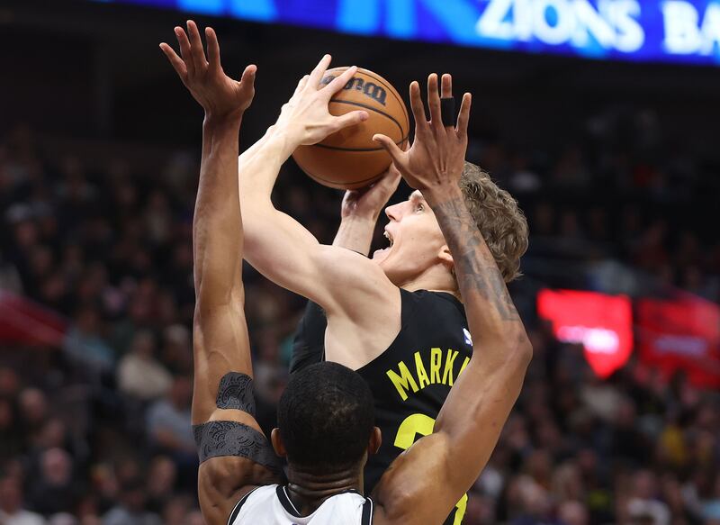Utah Jazz forward Lauri Markkanen (23) drives past Brooklyn Nets center Nic Claxton (33) in Salt Lake City on Friday, Jan. 20, 2023.