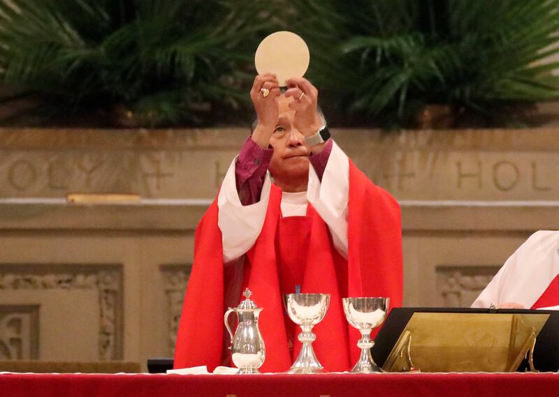 Bishop Scott Hayashi holds up the Eucharist during the Holy Eucharist with Consecration of Chrism and Renewal of Vows service at the Cathedral Church of St. Mark in Salt Lake City on Tuesday, April 16, 2019.