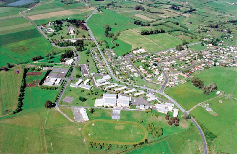 Dedicated in 1958 by LDS Church President David O. McKay, the Church College of New Zealand campus is located adjacent to the Hamilton New Zealand Temple, which appears in the upper left of the photo.