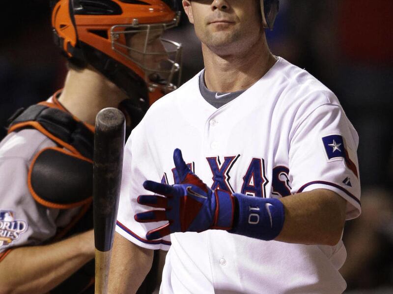FILE - In this Oct. 31, 2010, file photo, Texas Rangers' Michael Young strikes out during the ninth inning of Game 4 of baseball's World Series against the San Francisco Giants in Arlington, Texas. Young has asked the Texas Rangers to trade him. Texas G