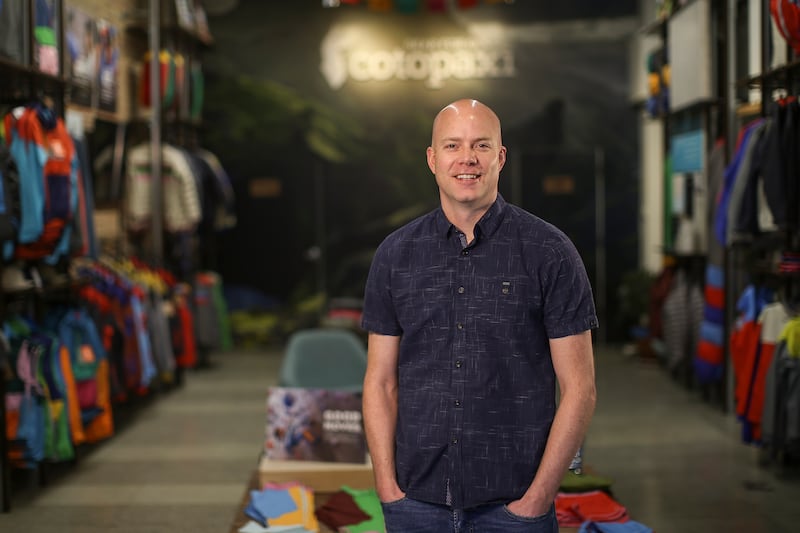 Davis Smith, co-founder and CEO of Cotopaxi, poses for a photo at Cotopaxi’s headquarters in Salt Lake City.