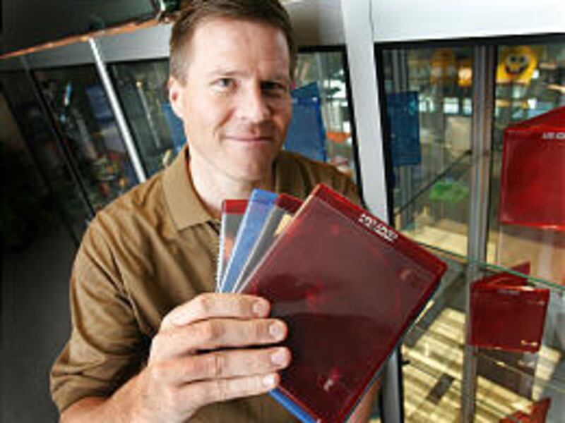 Warren Osborn, CEO of Seastone Media Group, shows the cases his company is producing for high-definition DVDs.