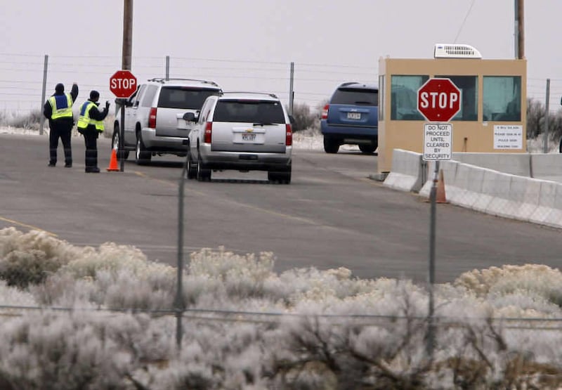 Vehicles are stopped at the main gate at Dugway Proving Ground military base Thursday, Jan. 27, 2011, about 85 miles southwest Salt Lake City, Utah.