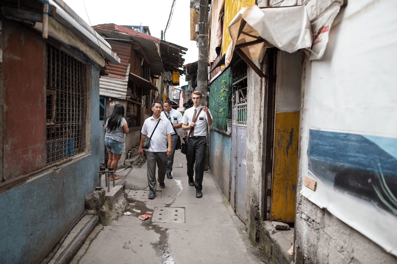 Missionaries for The Church of Jesus Christ of Latter-day Saints walk through the streets of the Philippines. The church reported having the highest number of convert baptisms in a 12-month period on July 9, 2025.