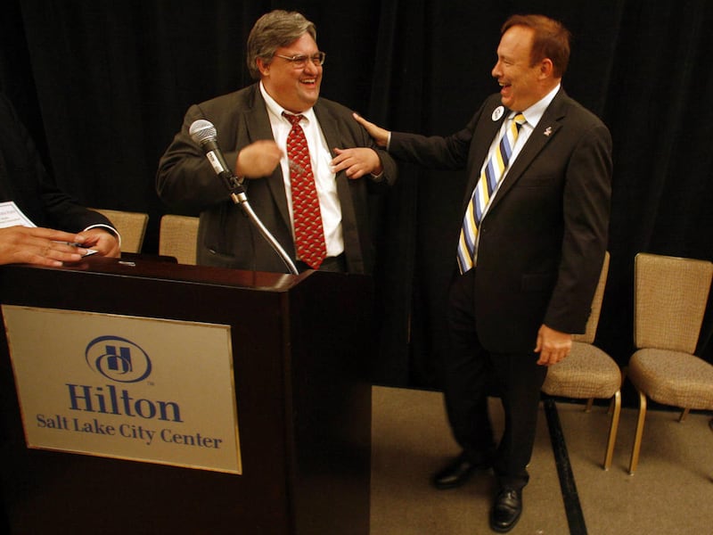 Todd Taylor, left, executive director of the Utah Democratic Party, and Jim Dabakis, newly elected state party chairman, talk after the election announcements at the Utah State Democratic Committee Organizing Convention at the Salt Lake City Hilton in Sal