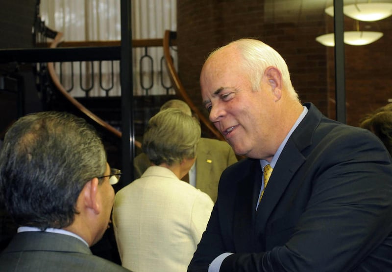 James T. Evans talks with City Council Member and mayor pro tem Carl Hernandez moments after Evans was chosen to fill the remaining two years of Orem Mayor Jerry Washburn's term, Monday, Oct. 24, 2011. Washburn died in September after battling cancer.