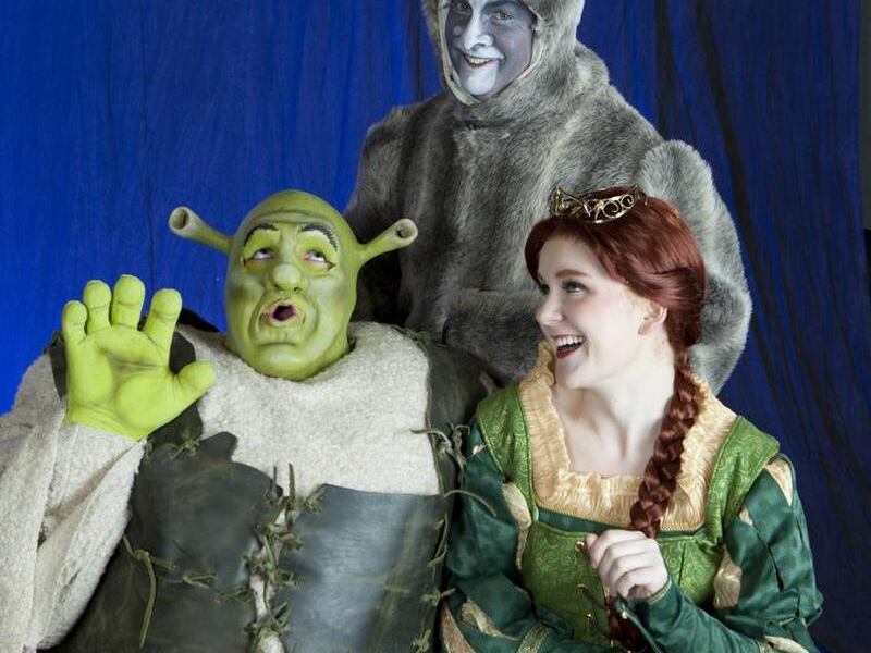 Cameron Kapetanov, left, as Shrek, Douglas Caldwell as Donkey and Katie Frandsen as Fiona in CenterPoint Legacy Theatre's production of “Shrek the Musical.”