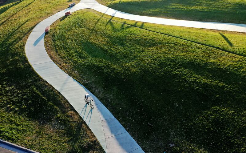 A biker rides through Sugar House Park in Salt Lake City on Tuesday, Nov. 23, 2021. 