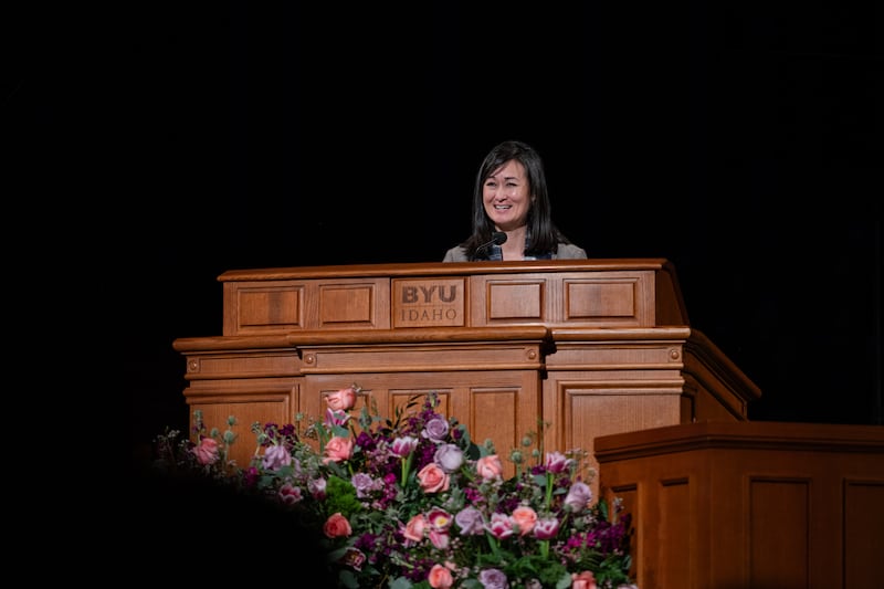Sister Kristin M. Yee, second counselor in the Relief Society general presidency, stands at the podium and speaks at the BYU–I Center in Rexburg, Idaho, on Tuesday, Jan. 28, 2025.