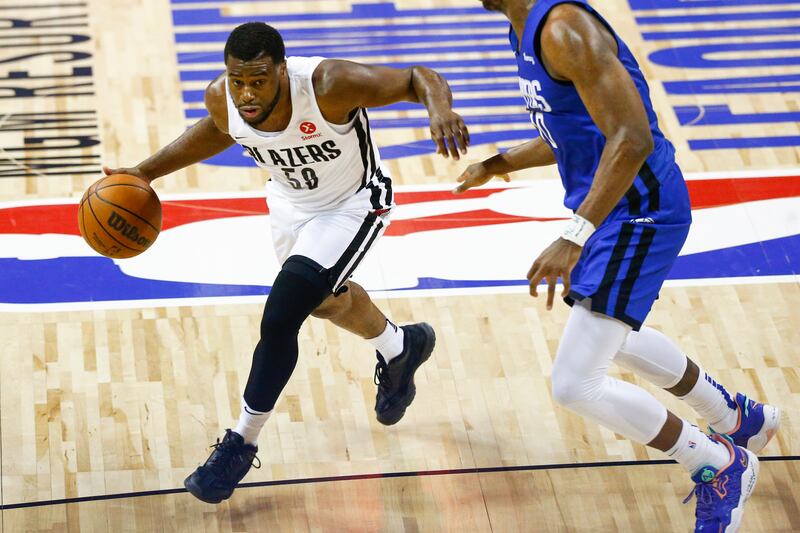 Portland Trail Blazers’ Emmanuel Mudiay drives to the basket against Los Angeles Clippers’ Daniel Oturu.