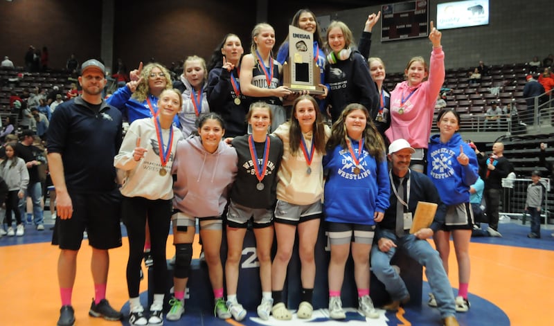 The Duchesne High School girls wrestling team celebrates its first state title on Saturday, February 10, 2024 in Richfield. 