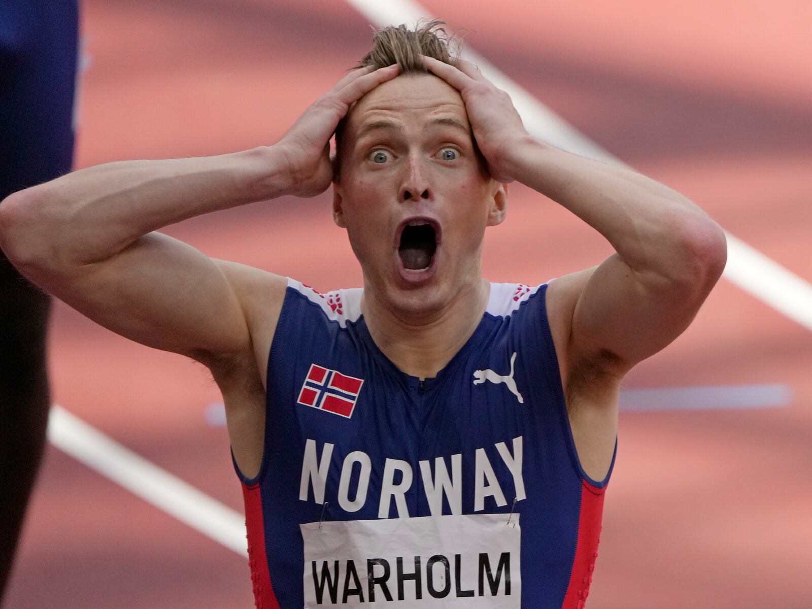 Karsten Warholm, of Norway celebrates as he wins the gold medal in the final of the men’s 400-meter hurdles at the 2020 Summer Olympics