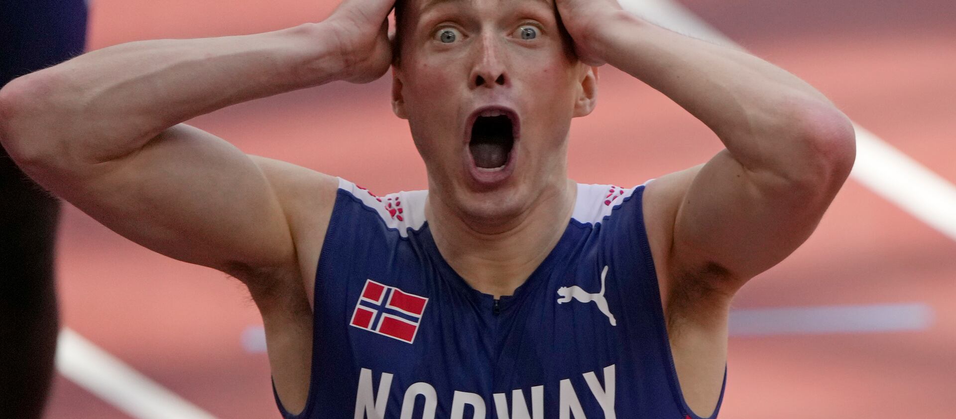 Karsten Warholm, of Norway celebrates as he wins the gold medal in the final of the men’s 400-meter hurdles at the 2020 Summer Olympics