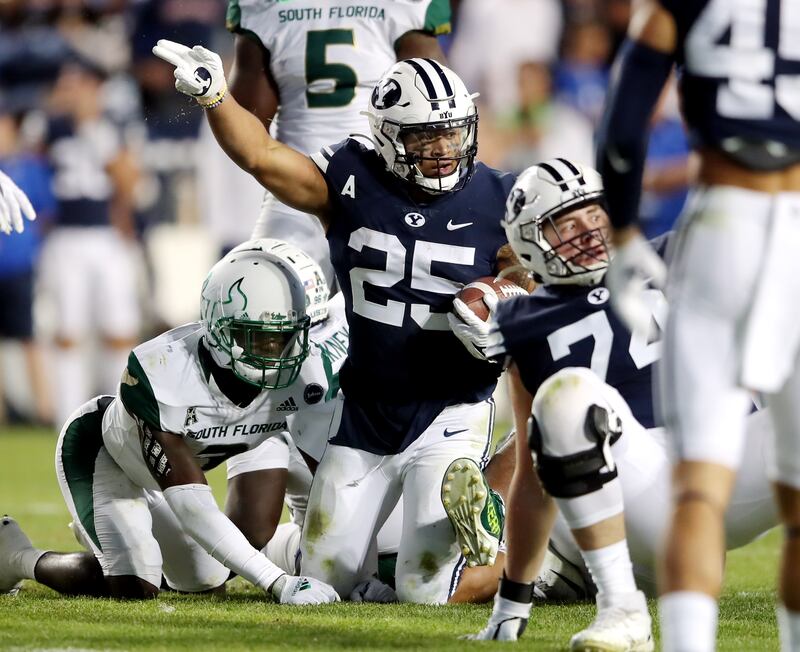 Brigham Young Cougars running back Tyler Allgeier (25) motions first down after a run as BYU and USF play a college football game.