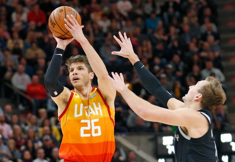 Detroit Pistons guard Luke Kennard, right, defends against Utah Jazz guard Kyle Korver (26) during the second half of an NBA basketball game Monday,Jan. 14 , 2019, in Salt Lake City. (AP Photo/Rick Bowmer)