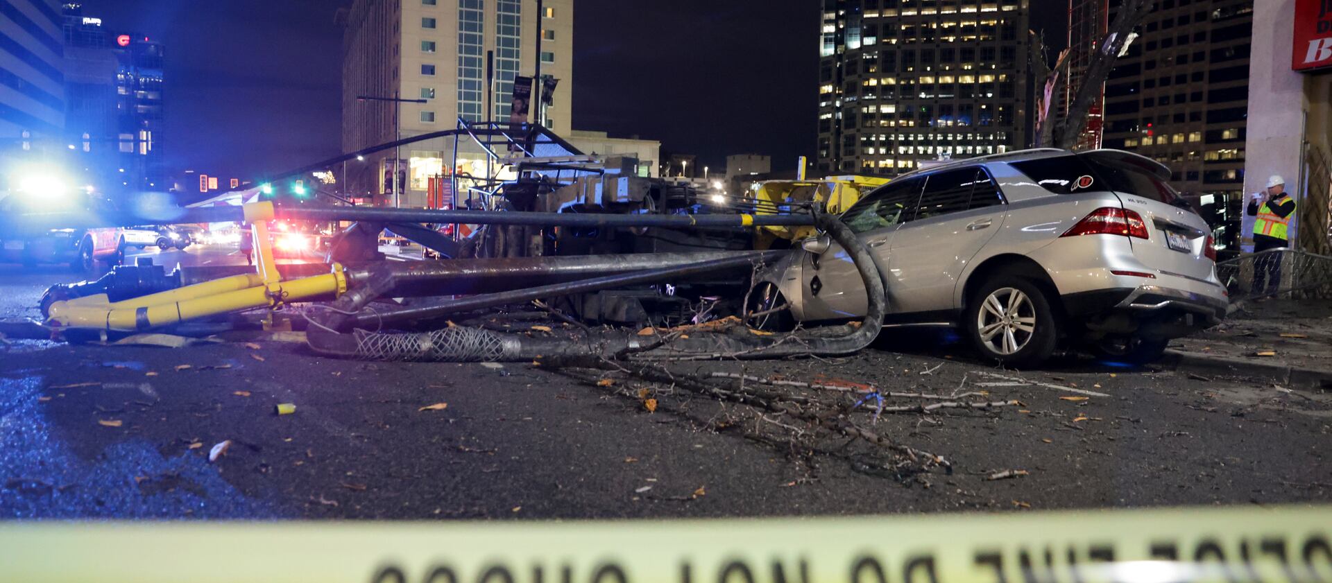 A drill rig crushed two cars on 200 South and State Street in Salt Lake City when it collapsed on Tuesday.
