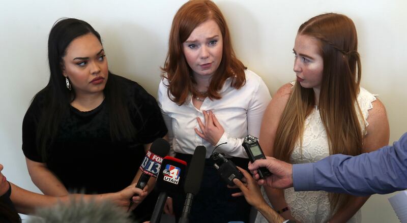 Neisha Williams, left, Ashley Fine and Kennedy Stoner, sorority sisters of University of Utah student Mackenzie Lueck, talk to members of the media after Ayoola Adisa Ajayi, who is charged in Lueck's death, appeared on a video feed from the Salt Lake Coun