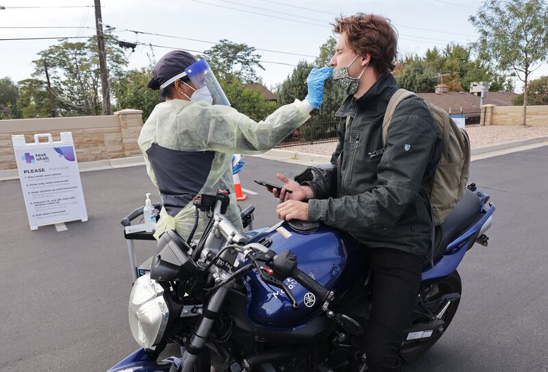 Matthew James is tested for COVID-19 at Cottonwood Heights City Hall parking lot.