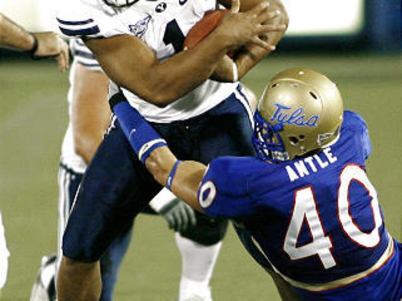 BYU's Fui Vakapuna is stopped by Tulsa's Tanner Antle on Saturday night.