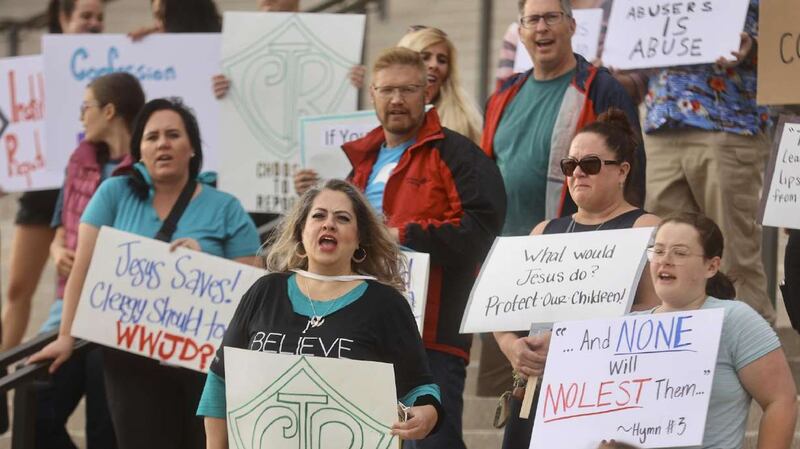 Protesters gather at the state Capitol in Salt Lake City on Friday to encourage Utah to eliminate a clergy abuse reporting exemption in state law.