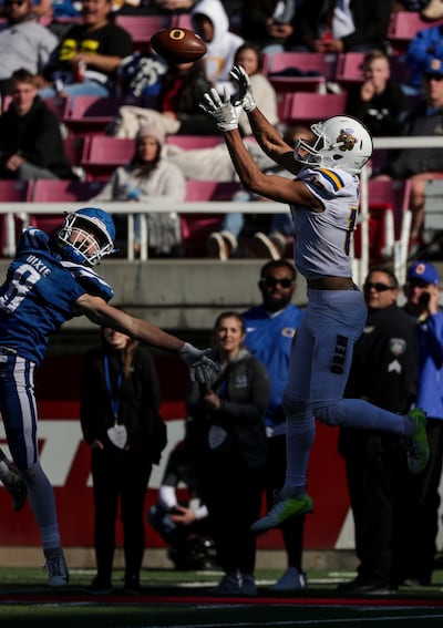 Orem's Puka Nakua receives a long pass and runs it in for a touchdown, putting Orem up 54-6 after the PAT, in the 4A football state championship game against Dixie at Rice-Eccles Stadium in Salt Lake City on Friday, Nov. 16, 2018.