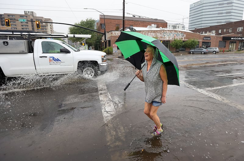 Rain comes down in Salt Lake City, bringing cooler temperatures to the Wasatch Front but also posing threats of flash flooding.