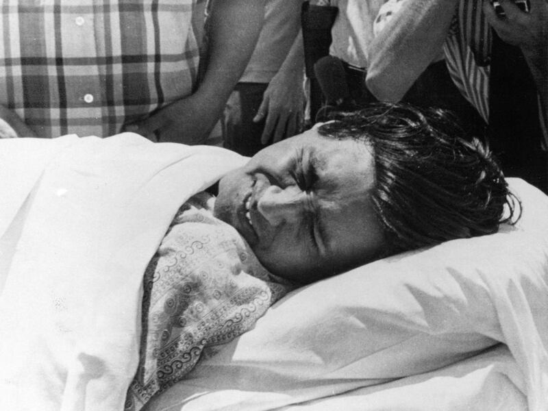 FILE - This May 31, 1972 photo shows United Farm Workers leader Cesar Chavez, suffering from the effects of a 20-day hunger strike, as he's wheeled form his Phoenix, Ariz. barrio headquarters to be taken to a hospital. The National Park Service is conduct