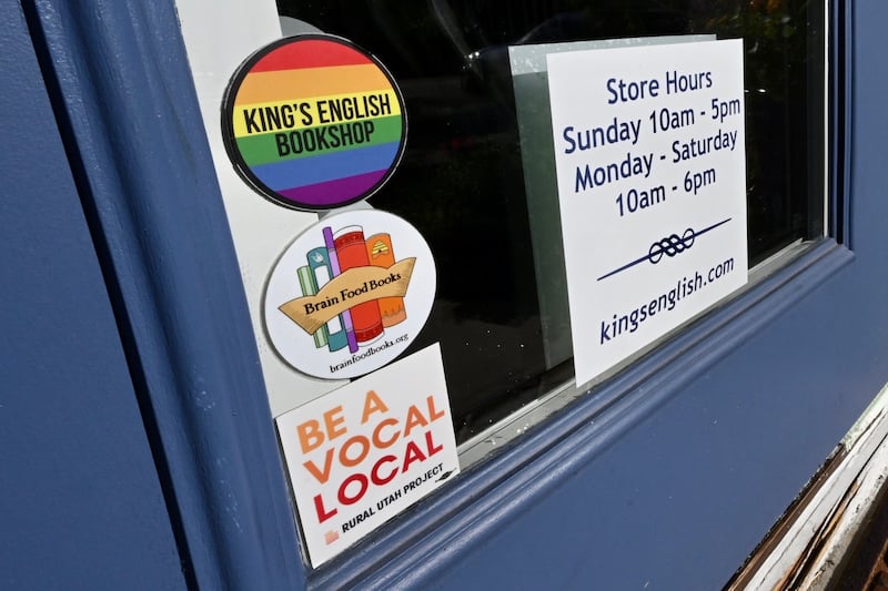 Stickers and signs are shown on the door at the King’s English Bookstore in Salt Lake City.