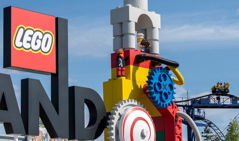 A roller coaster can be seen next to the logo at the entrance to the Legoland amusement park in Guenzburg, southern Germany.
