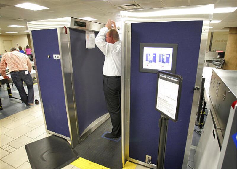 Dave Couts, a program analyst for the Transportation and Safety Administration, demonstrates the new Rapid Scan 1000.