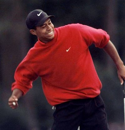 Tiger Woods pumps his fist after winning the Masters in 1997.