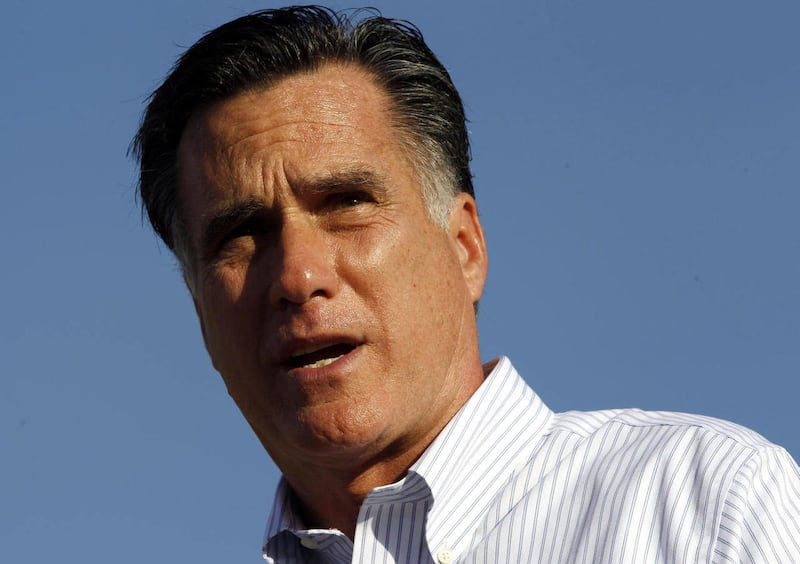 Republican presidential candidate, former Massachusetts Gov. Mitt Romney stands in front of a foreclosed home in Lehigh Acres, Fla., Tuesday, Jan. 24, 2012.