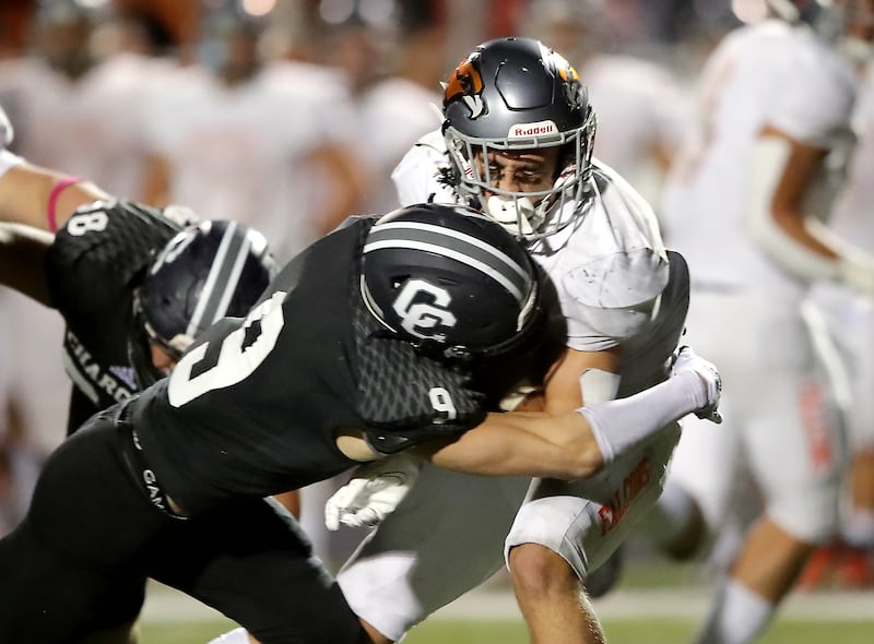 Corner Canyon’s Harrison Taggart brings down Skyridge’s Jeter Fenton during game at Corner Canyon in Draper, Sept. 24, 2021.