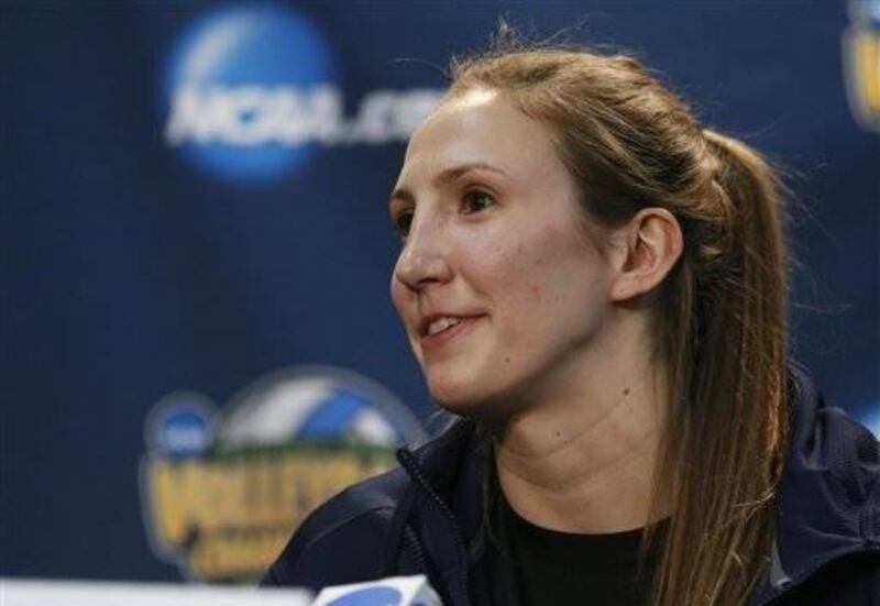 BYU's Jennifer Hamson answers a question during an NCAA women's volleyball tournament news conference in Oklahoma City, Friday, Dec. 19, 2014. BYU faces Penn State for the championship on Saturday.