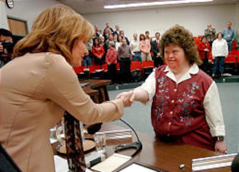 Kauri Sue Hamilton, whose parents donated land for school, thanks members of the Jordan Board Tuesday.