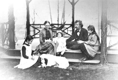 Mark Twain, second from right, sits on a gazebo with others in this undated portrait from Hartford, Conn.