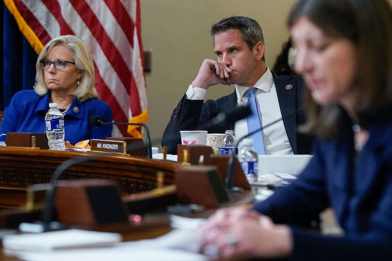 Rep. Liz Cheney, R-Wyo., and Rep. Adam Kinzinger, R-Ill., listen during the House select committee hearing on the Jan. 6 attack.