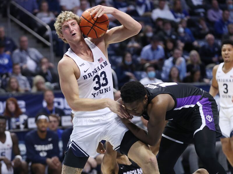 BYU forward Caleb Lohner (33) grabs a loose ball in Provo on Saturday, Jan. 22, 2022.