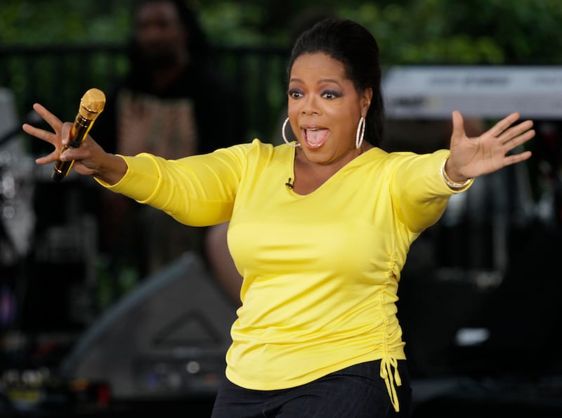 FILE - This Sept. 8, 2009 file photo shows, Oprah Winfrey waves to her fans in Chicago while taping an episode of “The Oprah Winfrey Show” on a three-block stretch of Chicago’s Michigan Avenue near the Chicago River, to celebrate the start of the 24th season of her show. On Monday, Sept. 13, 2010, the 25th and final season of “The Oprah Winfrey Show” begins airing. (AP Photo/Kiichiro Sato, File)