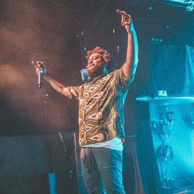 A photo of Bas performing during a recent show. Abbas Hamad, known as Bas, is an international artist in more ways than one.