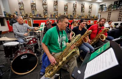 Jeff Moyes plays bari sax as musicians gather at American Fork High School in American Fork on Tuesday, Nov. 28, 2017, to rehearse as a new professional big band.