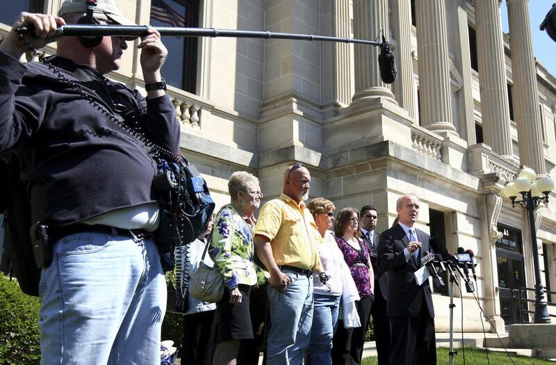 Following the not guilty verdict in the trial of Jack McCullough for the alleged 1962 rape of his half-sister Jeanne Tessier, DeKalb County States Attorney Clay Campbell addresses the media, with members of the Tessier family behind him, outside the DeKal
