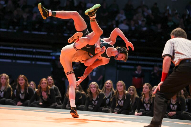 Wasatch’s Austin Kelly throws Payson’s Colton Theobald in the 5A wrestling state championship in 2022.