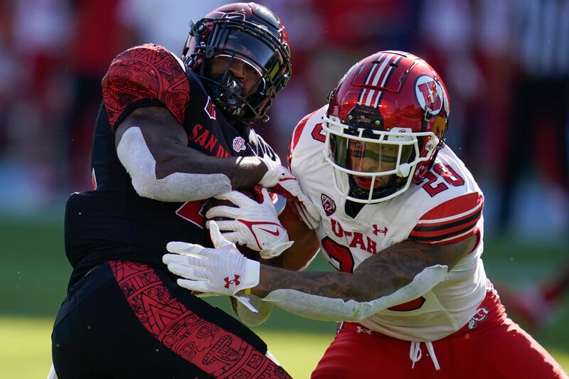 Utah’s Brandon McKinney tackles San Diego State running back Greg Bell during game Sept. 18, 2021, in Carson, California.